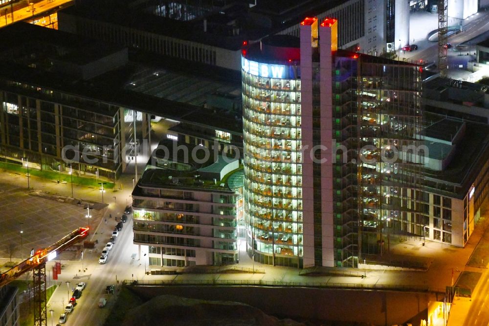 Stuttgart at night from the bird perspective: Night lighting high-rise skyscraper building and bank administration of the financial services company Landesbank Baden-Wuerttemberg on Heilbronner Strasse - Osloer Strasse - Warschauer Strasse in the district Europaviertel in Stuttgart in the state Baden-Wurttemberg, Germany