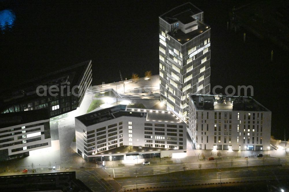 Aerial image at night Hamburg - Night lighting office and commercial building WATERMARK, Intelligent Quarters und Universitaet Hamburg in the Hafen City in Hamburg, Germany