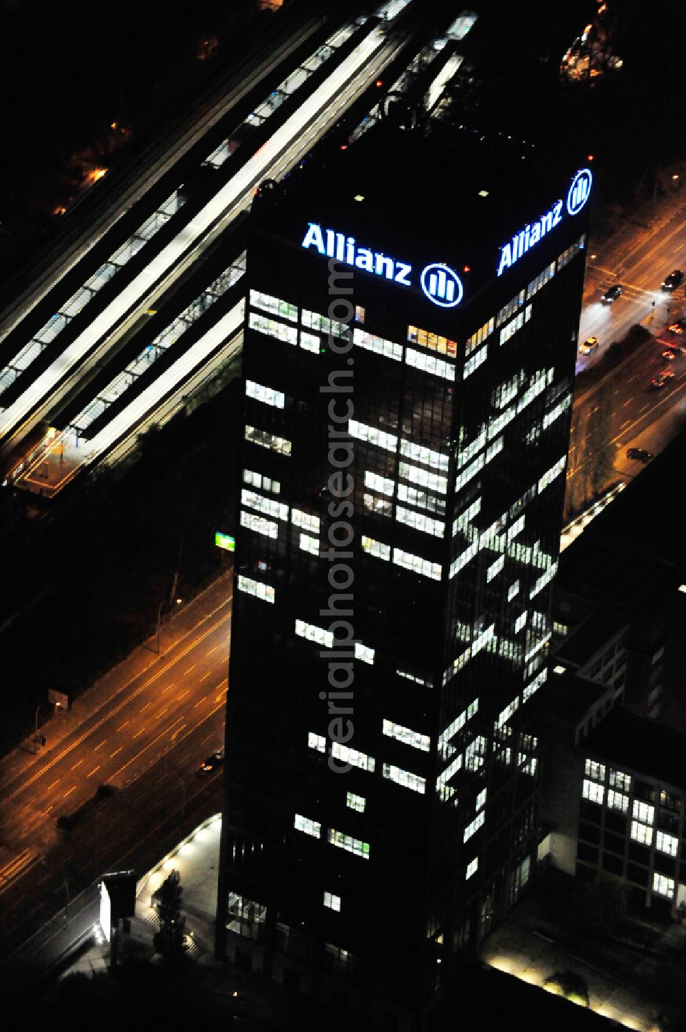 Aerial image at night Berlin - Night lighting office buildings and commercial high-rise complex Treptower on street An den Treptowers in the district Treptow in Berlin, Germany