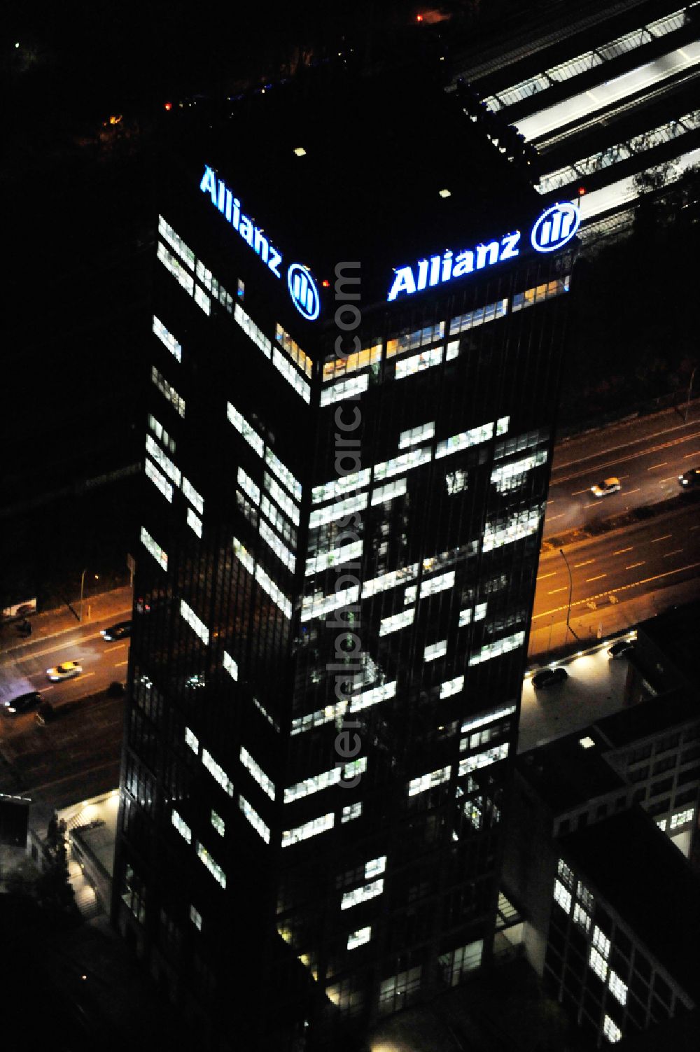 Aerial photograph at night Berlin - Night lighting office buildings and commercial high-rise complex Treptower on street An den Treptowers in the district Treptow in Berlin, Germany