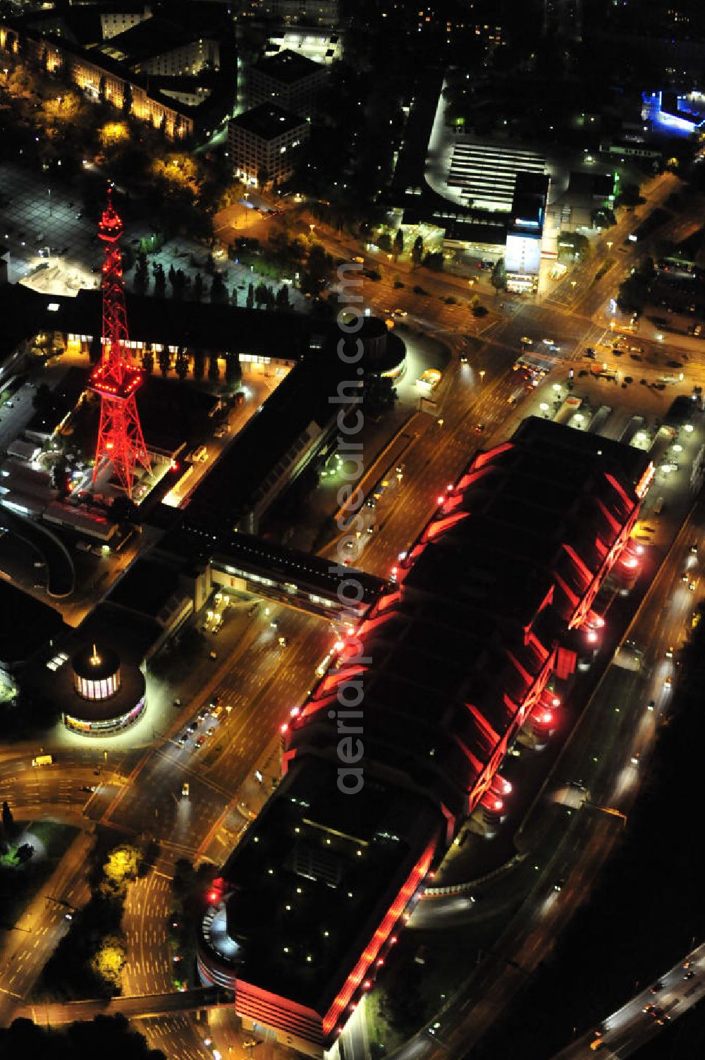 Berlin at night from above - Nachtaufnahme: Internationales Congress Centrum ICC am Messegelände mit Funkturm und Avus in Charlottenburg. Night Shot: Internationales Congress Centrum ICC at the fairground with radio tower and Avus - ring-road in Berlin.