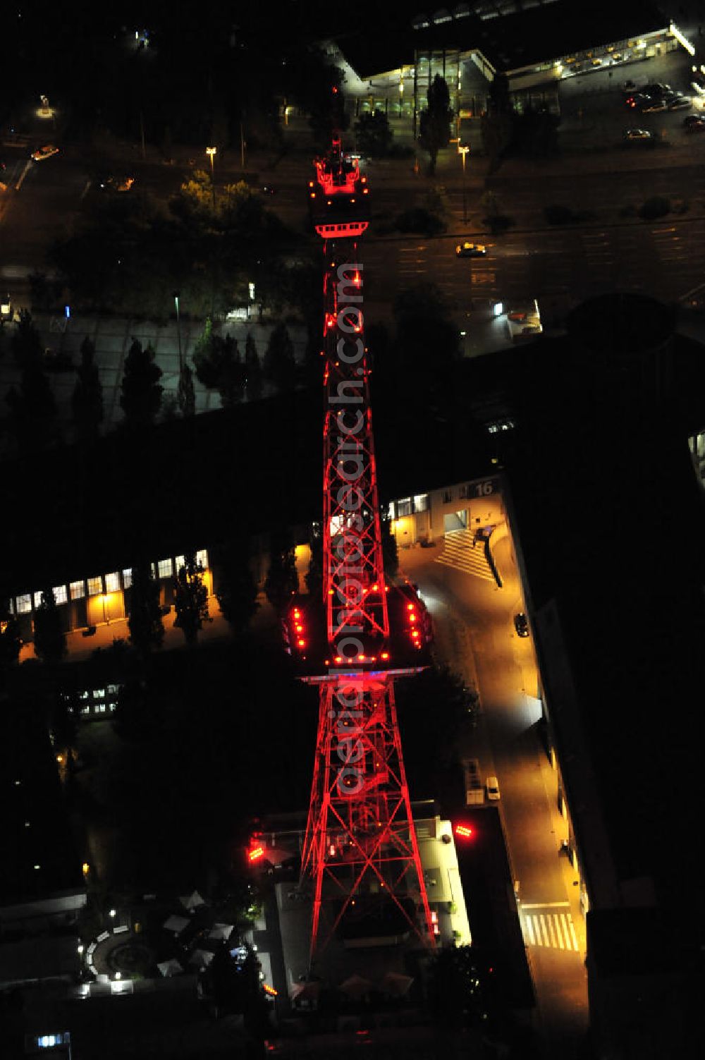 Aerial photograph at night Berlin - Nachtaufnahme: Internationales Congress Centrum ICC am Messegelände mit Funkturm und Avus in Charlottenburg. Night Shot: Internationales Congress Centrum ICC at the fairground with radio tower and Avus - ring-road in Berlin.