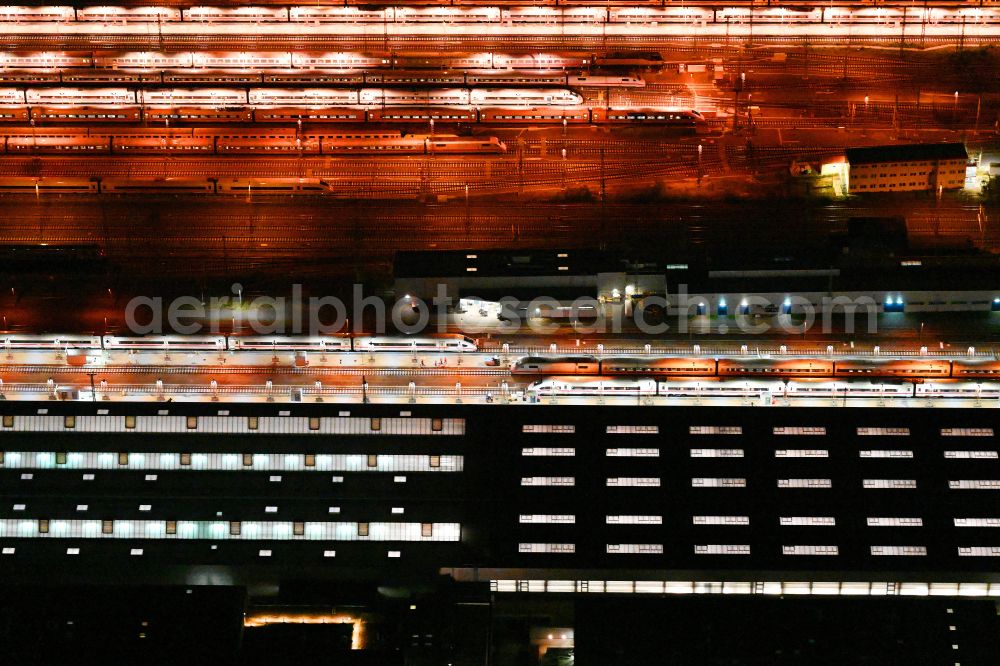 Aerial image at night Berlin - Night lighting building of ICE-Werk Berlin Rummelsburg on street Gundelfinger Strasse in the district Rummelsburg in Berlin, Germany