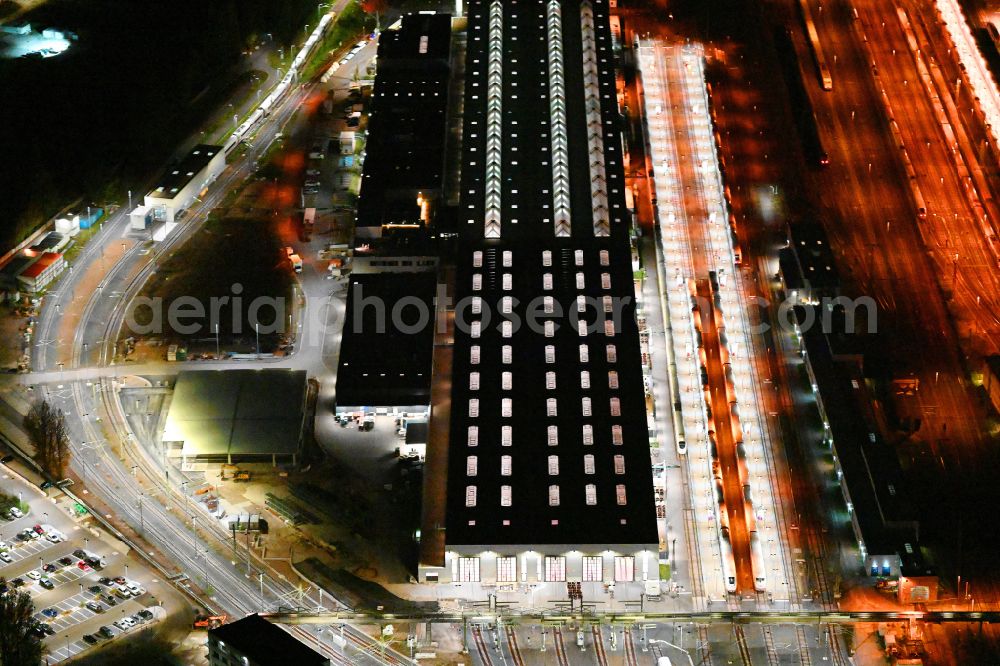 Aerial photograph at night Berlin - Night lighting building of ICE-Werk Berlin Rummelsburg on street Gundelfinger Strasse in the district Rummelsburg in Berlin, Germany