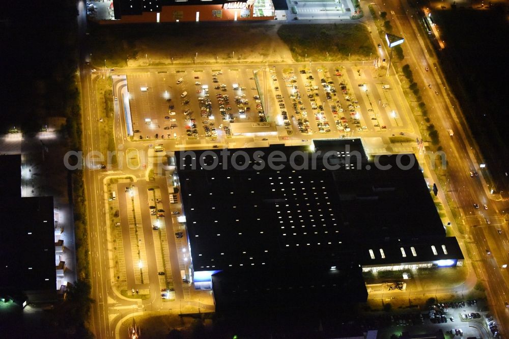 Berlin at night from the bird perspective: Night view IKEA furniture store - Furniture Center at the Landsberger Allee in Berlin - Hohenschonhausen