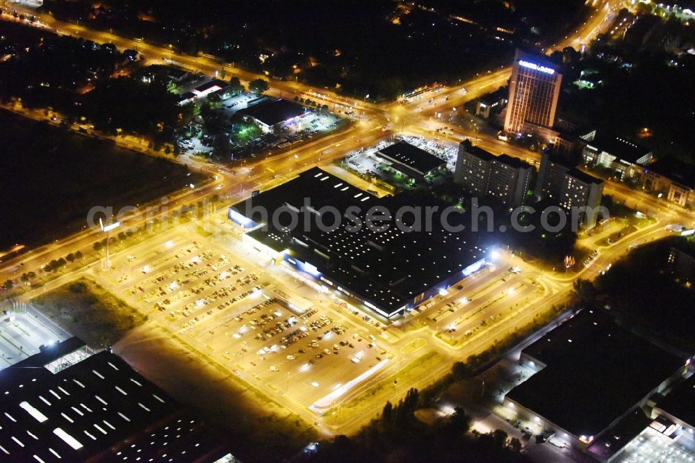 Berlin at night from the bird perspective: Night view IKEA furniture store - Furniture Center at the Landsberger Allee in Berlin - Hohenschonhausen