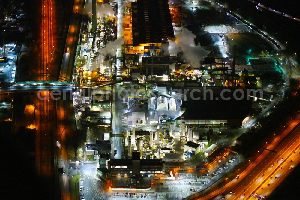 Hamburg at night from the bird perspective: Night lighting industrial and commercial area Mueggenburger Strasse - Georgswerder Bogen in the district Veddel in Hamburg, Germany