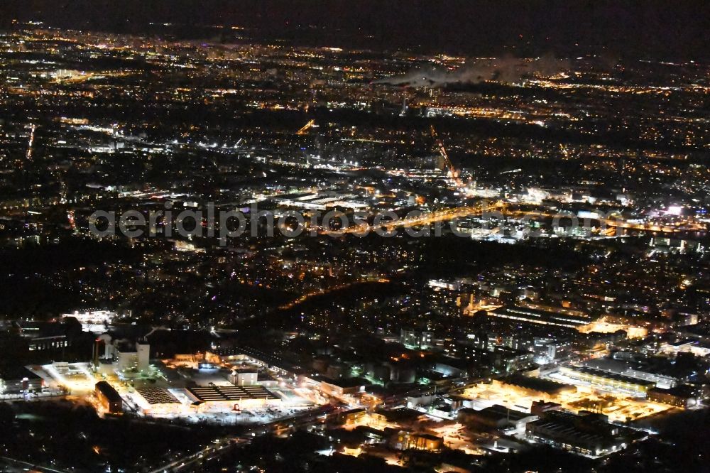 Aerial image at night Berlin - Night view industrial and commercial area Gradestrasse on river Teltowkanal in the district Britz in Berlin