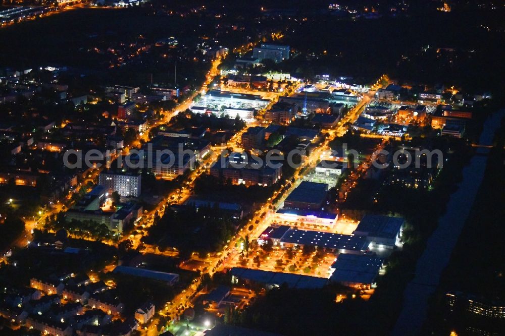 Aerial image at night Teltow - Night lighting industrial and commercial area along the Oderstrasse in Teltow in the state Brandenburg, Germany