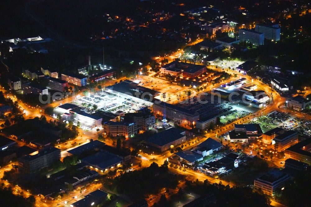 Teltow at night from the bird perspective: Night lighting industrial and commercial area along the Oderstrasse in Teltow in the state Brandenburg, Germany