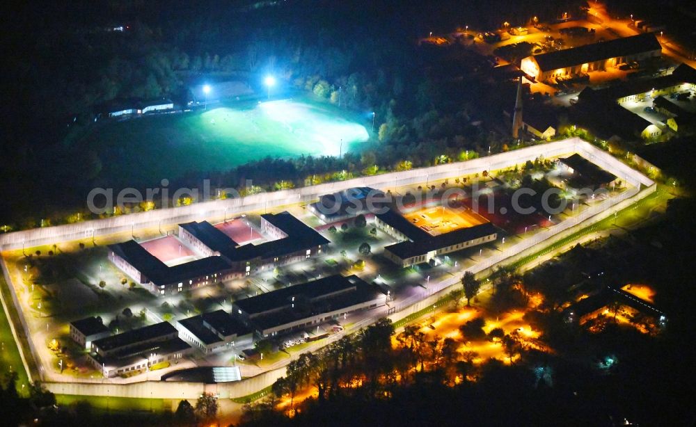 Wriezen at night from above - Night lighting prison grounds and high security fence Prison Justizvollzugsanstalt Nord-Brandenburg Teilanstalt Wriezen on street Schulzendorfer Strasse in the district Luedersdorf in Wriezen in the state Brandenburg, Germany