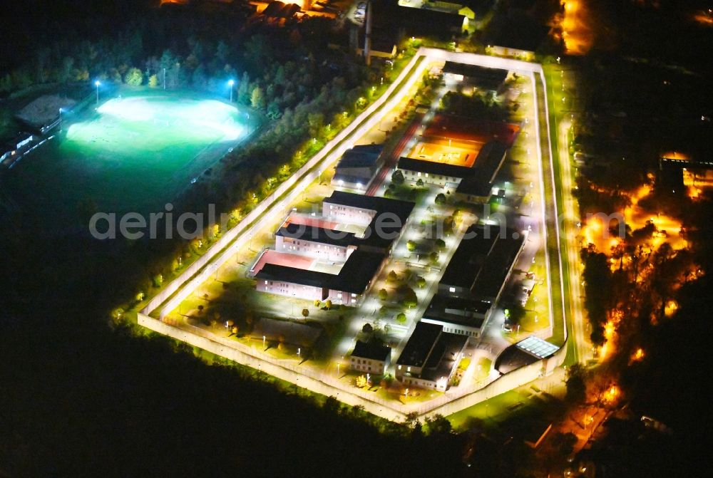 Wriezen at night from above - Night lighting prison grounds and high security fence Prison Justizvollzugsanstalt Nord-Brandenburg Teilanstalt Wriezen on street Schulzendorfer Strasse in the district Luedersdorf in Wriezen in the state Brandenburg, Germany