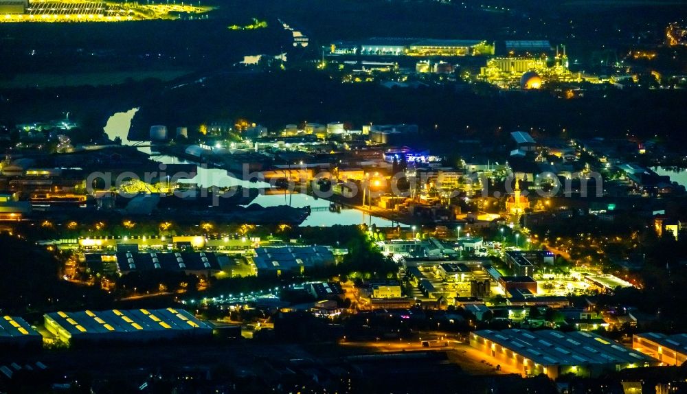 Dortmund at night from above - Night lighting quays and boat moorings at the port of the inland port in Dortmund in the state North Rhine-Westphalia, Germany