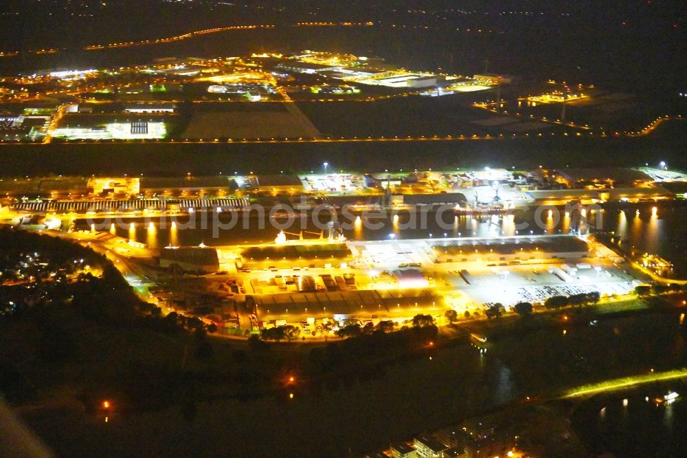 Aerial image at night Bremen - Night lighting Quays and boat moorings at the port of the inland port Neustaedter Hafen in Bremen, Germany