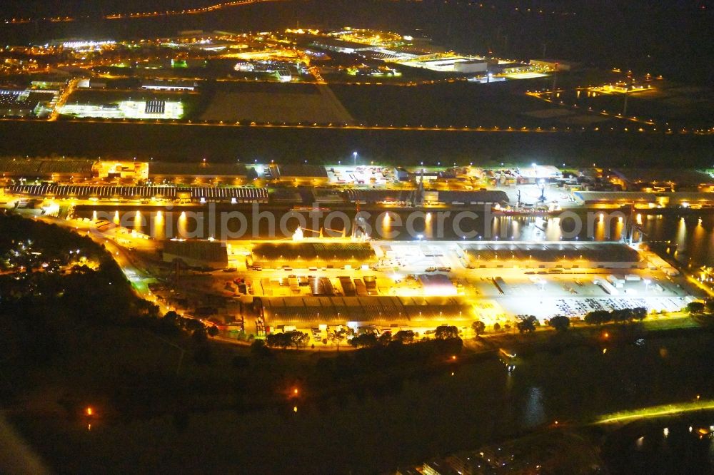 Bremen at night from above - Night lighting Quays and boat moorings at the port of the inland port Neustaedter Hafen in Bremen, Germany