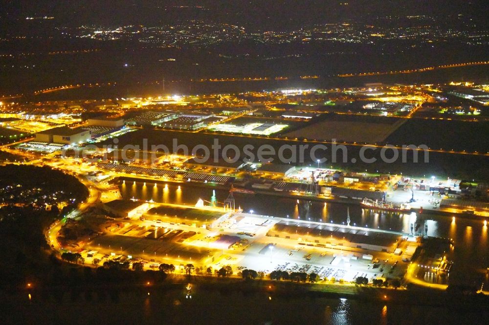 Aerial photograph at night Bremen - Night lighting Quays and boat moorings at the port of the inland port Neustaedter Hafen in Bremen, Germany