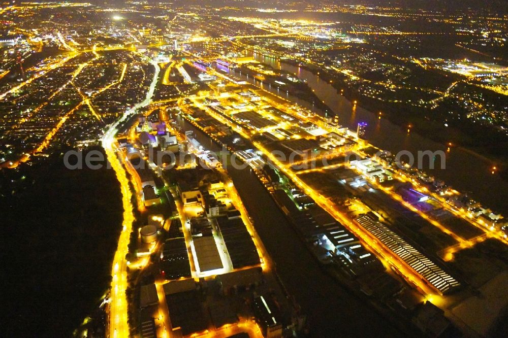 Aerial image at night Bremen - Night lighting Quays and boat moorings at the port of the inland port Neustaedter Hafen in Bremen, Germany