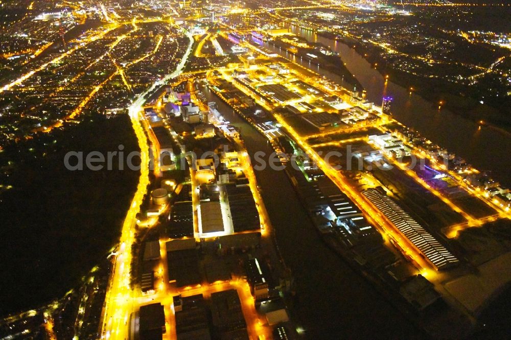 Bremen at night from above - Night lighting Quays and boat moorings at the port of the inland port Neustaedter Hafen in Bremen, Germany