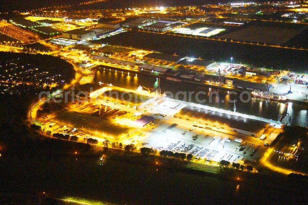 Aerial photograph at night Bremen - Night lighting Quays and boat moorings at the port of the inland port Neustaedter Hafen in Bremen, Germany