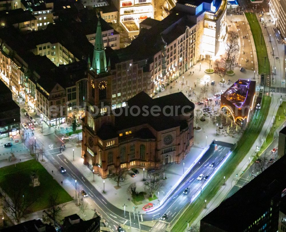 Aerial image at night Düsseldorf - Night lighting church building Johanneskirche on Martin-Luther-Platz in Duesseldorf in the state North Rhine-Westphalia, Germany