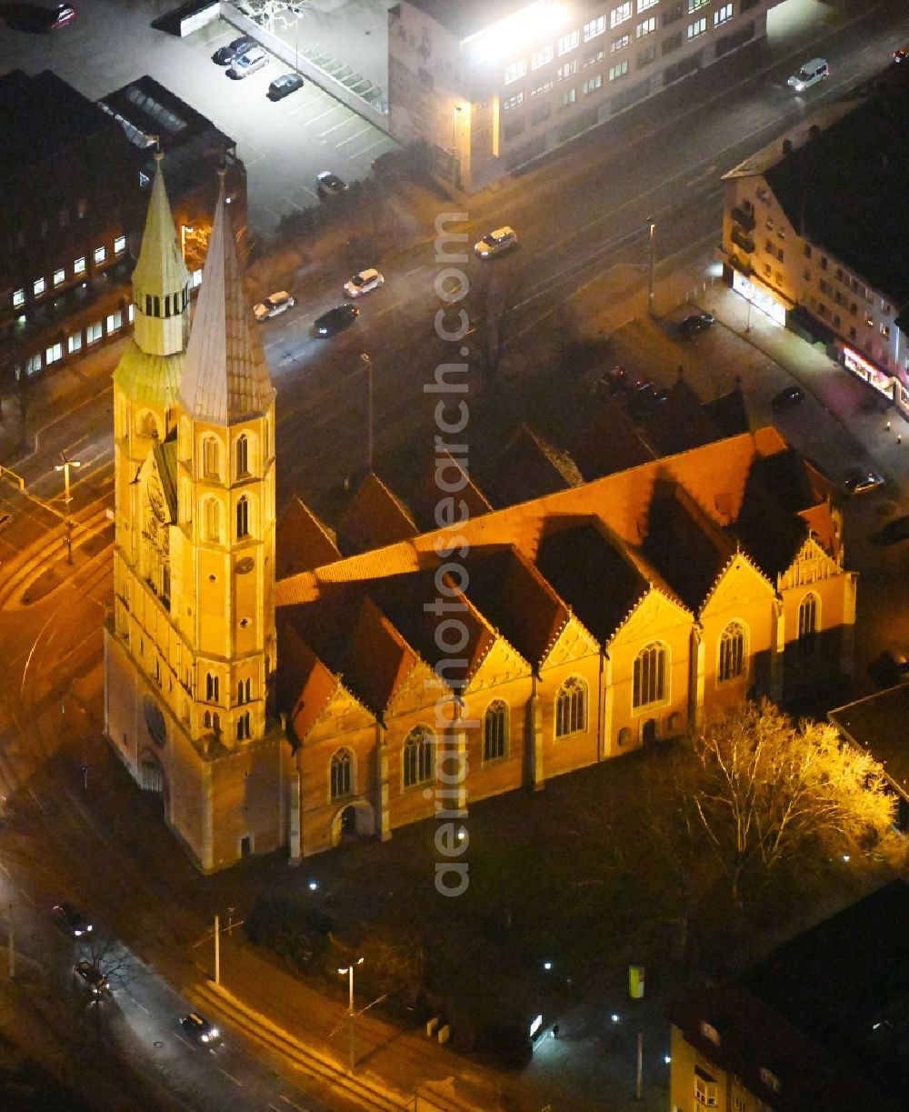 Aerial image at night Braunschweig - Night lights and lighting church building the Saint Katharinenkirche in Braunschweig in the federal state Lower Saxony