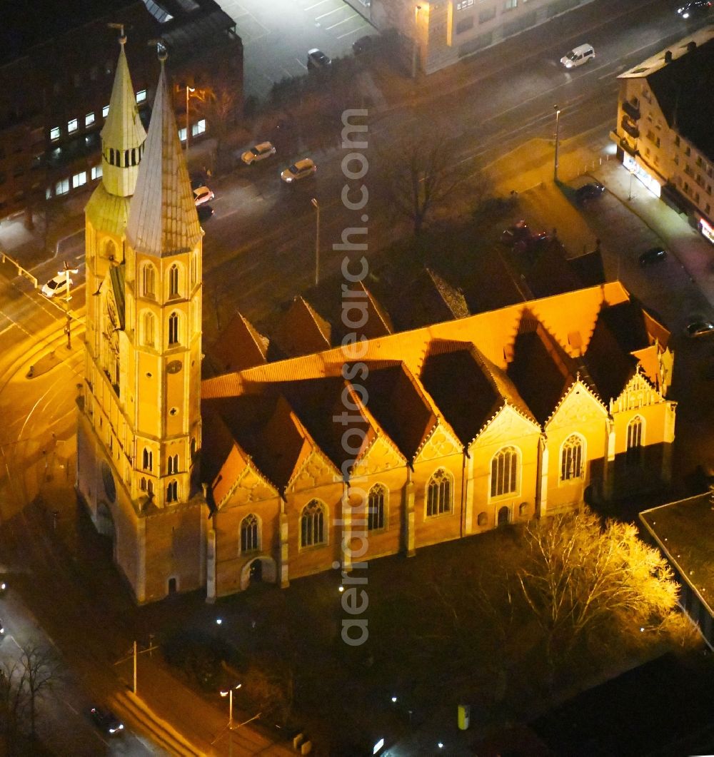 Braunschweig at night from the bird perspective: Night lights and lighting church building the Saint Katharinenkirche in Braunschweig in the federal state Lower Saxony