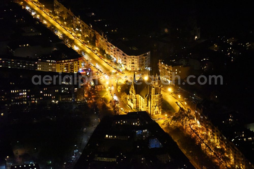 Aerial photograph at night Berlin - Night view church building Kirche am Suedstern in Berlin