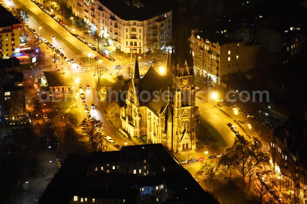 Aerial image at night Berlin - Night view church building Kirche am Suedstern in Berlin