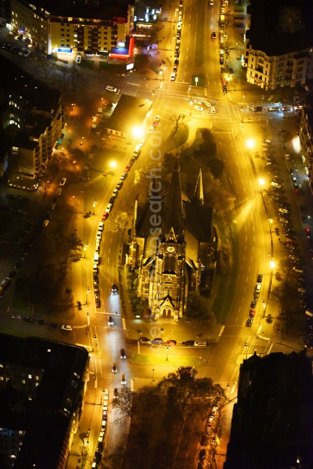 Berlin at night from the bird perspective: Night view church building Kirche am Suedstern in Berlin