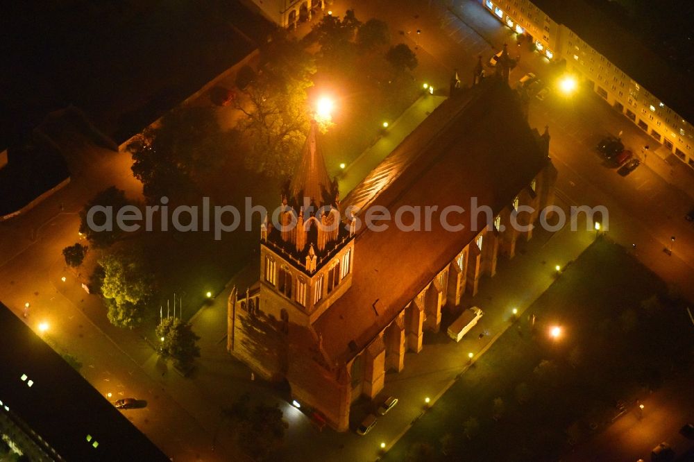 Neubrandenburg at night from the bird perspective: Night lighting Church building in Konzertkirche - Marienkirche Old Town- center of downtown in Neubrandenburg in the state Mecklenburg - Western Pomerania, Germany