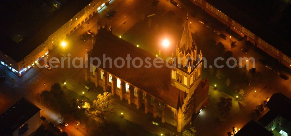 Aerial image at night Neubrandenburg - Night lighting Church building in Konzertkirche - Marienkirche Old Town- center of downtown in Neubrandenburg in the state Mecklenburg - Western Pomerania, Germany