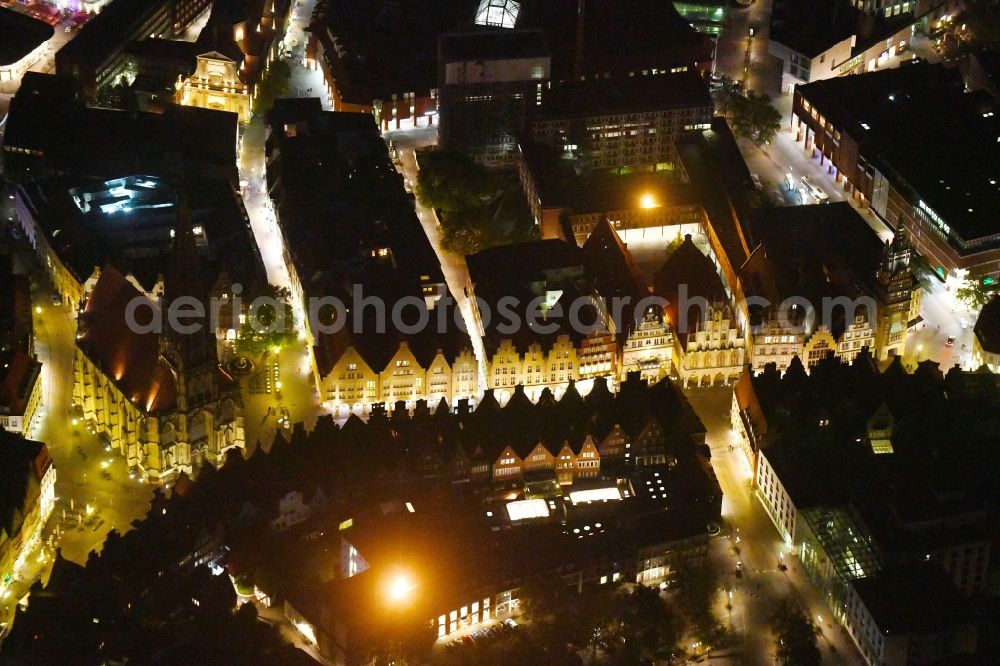 Aerial image at night Münster - Night lighting Church building in St. Lonberti-Kirche on Place Lambertikirchplatz on Old Town- center of downtown in Muenster in the state North Rhine-Westphalia, Germany