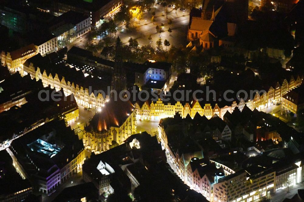 Aerial image at night Münster - Night lighting Church building in St. Lonberti-Kirche on Place Lambertikirchplatz on Old Town- center of downtown in Muenster in the state North Rhine-Westphalia, Germany