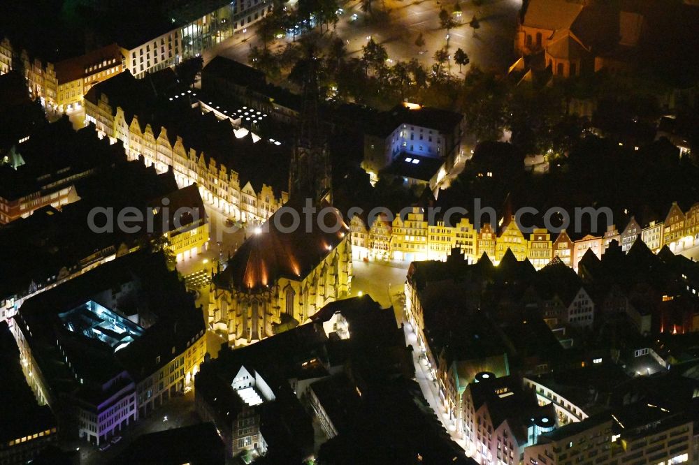 Münster at night from above - Night lighting Church building in St. Lonberti-Kirche on Place Lambertikirchplatz on Old Town- center of downtown in Muenster in the state North Rhine-Westphalia, Germany