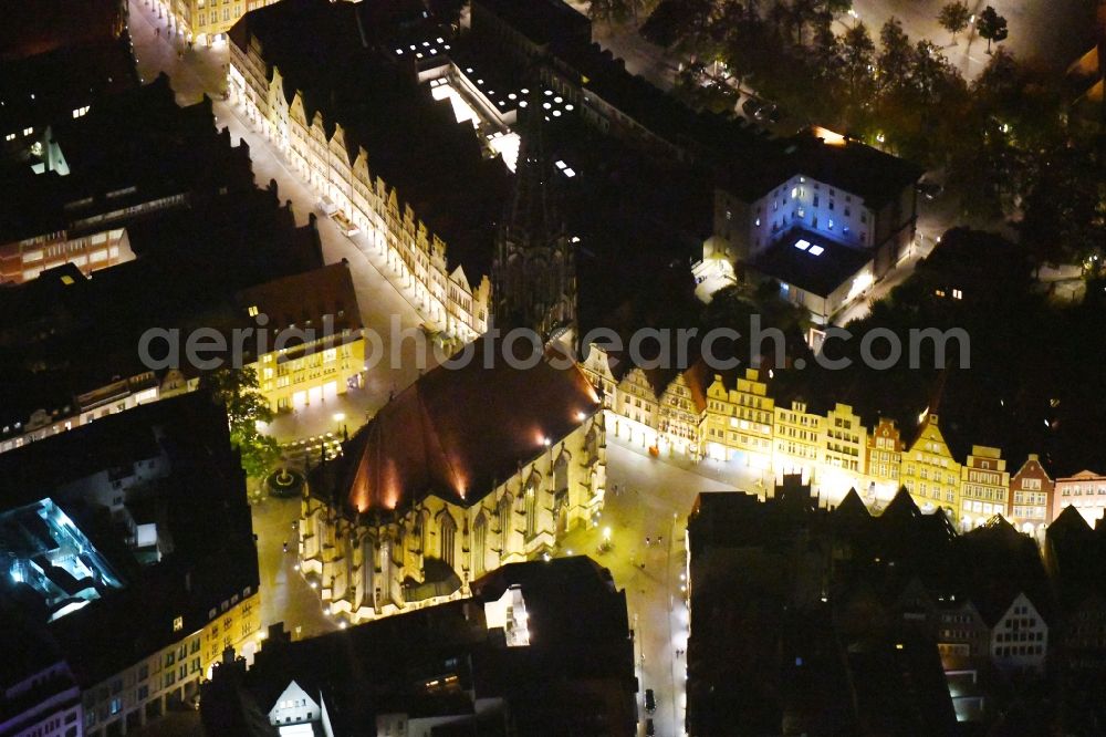 Aerial photograph at night Münster - Night lighting Church building in St. Lonberti-Kirche on Place Lambertikirchplatz on Old Town- center of downtown in Muenster in the state North Rhine-Westphalia, Germany