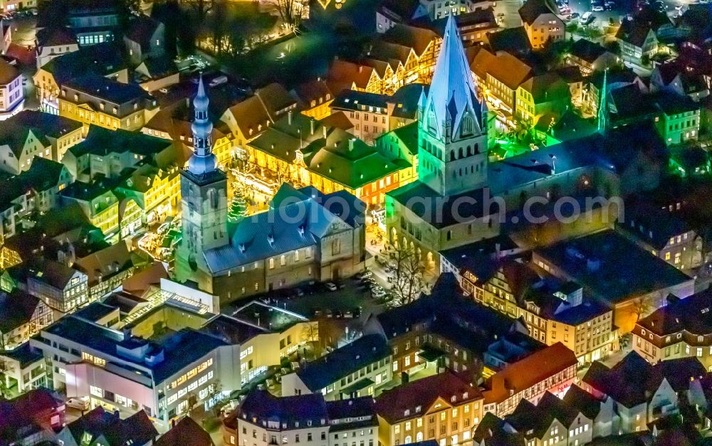 Soest at night from above - Night lighting church building in St. Patrokli- Dom and St. Petri (Alde Kerke) Old Town- center of downtown in Soest in the state North Rhine-Westphalia, Germany