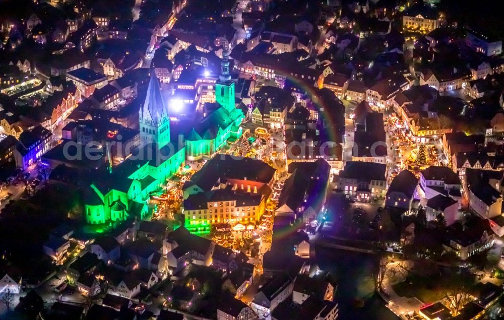 Aerial photograph at night Soest - Night lighting church building in St. Patrokli- Dom and St. Petri (Alde Kerke) Old Town- center of downtown in Soest in the state North Rhine-Westphalia, Germany