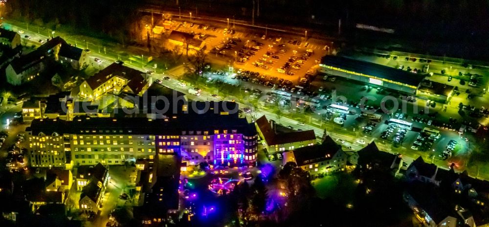 Aerial photograph at night Soest - Night lighting church building in St. Patrokli- Dom and St. Petri (Alde Kerke) Old Town- center of downtown in Soest in the state North Rhine-Westphalia, Germany