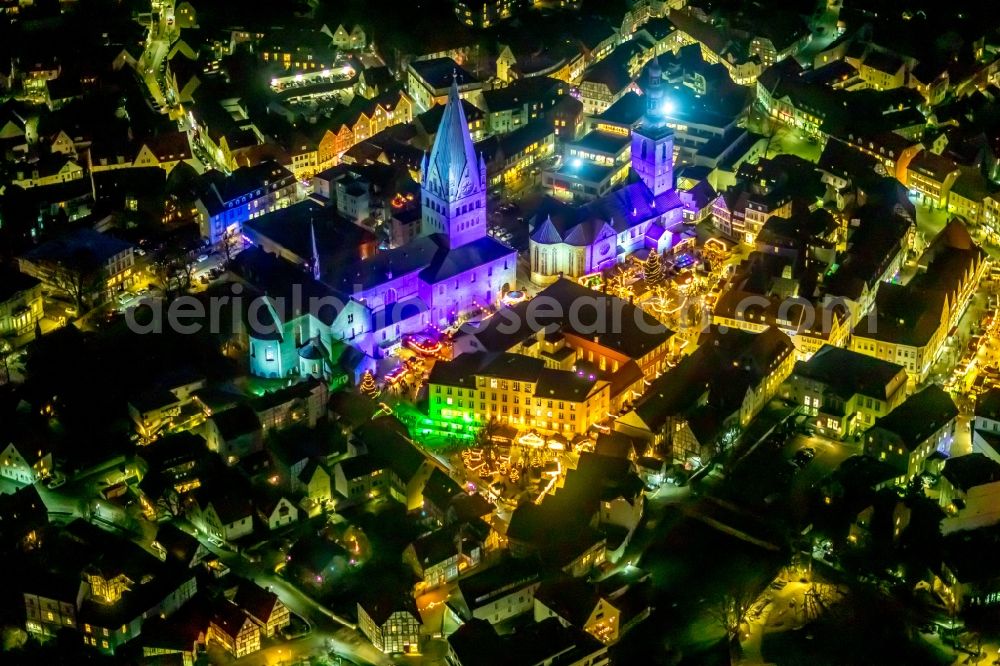 Soest at night from the bird perspective: Night lighting church building in St. Patrokli- Dom and St. Petri (Alde Kerke) Old Town- center of downtown in Soest in the state North Rhine-Westphalia, Germany