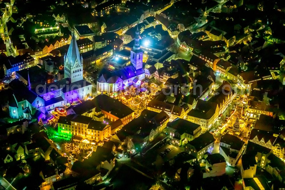 Aerial image at night Soest - Night lighting church building in St. Patrokli- Dom and St. Petri (Alde Kerke) Old Town- center of downtown in Soest in the state North Rhine-Westphalia, Germany