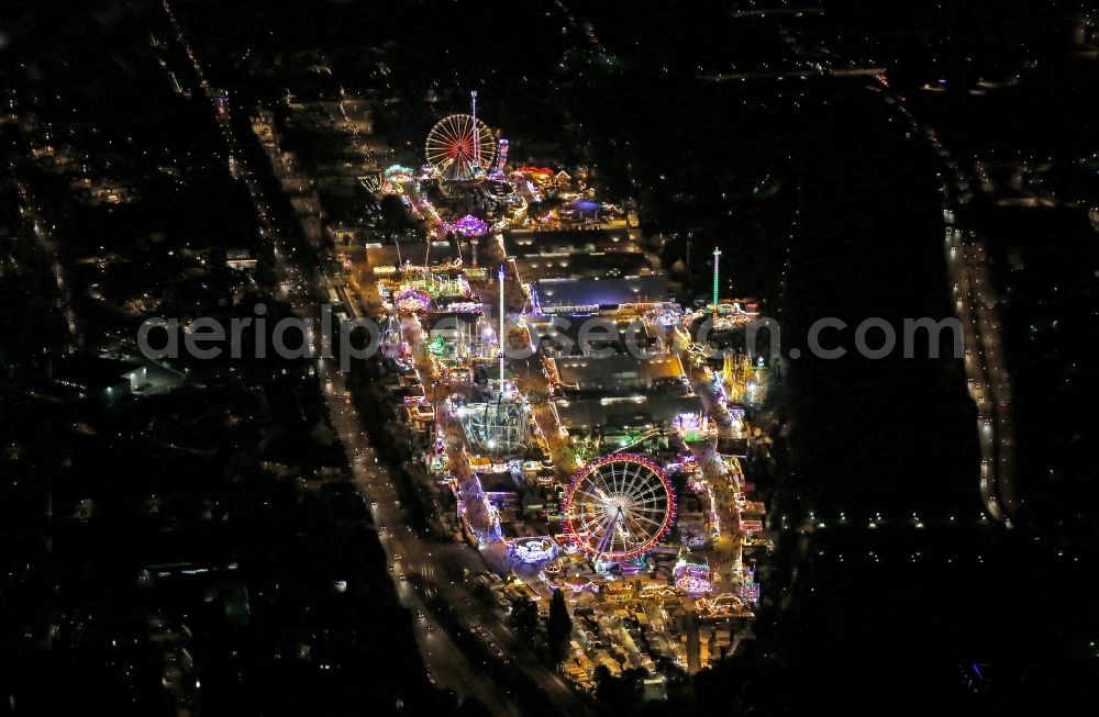 Aerial image at night Stuttgart - Night view of Fair - event location at festival auf den Cannstatter Wasen in Stuttgart in the state Baden-Wuerttemberg