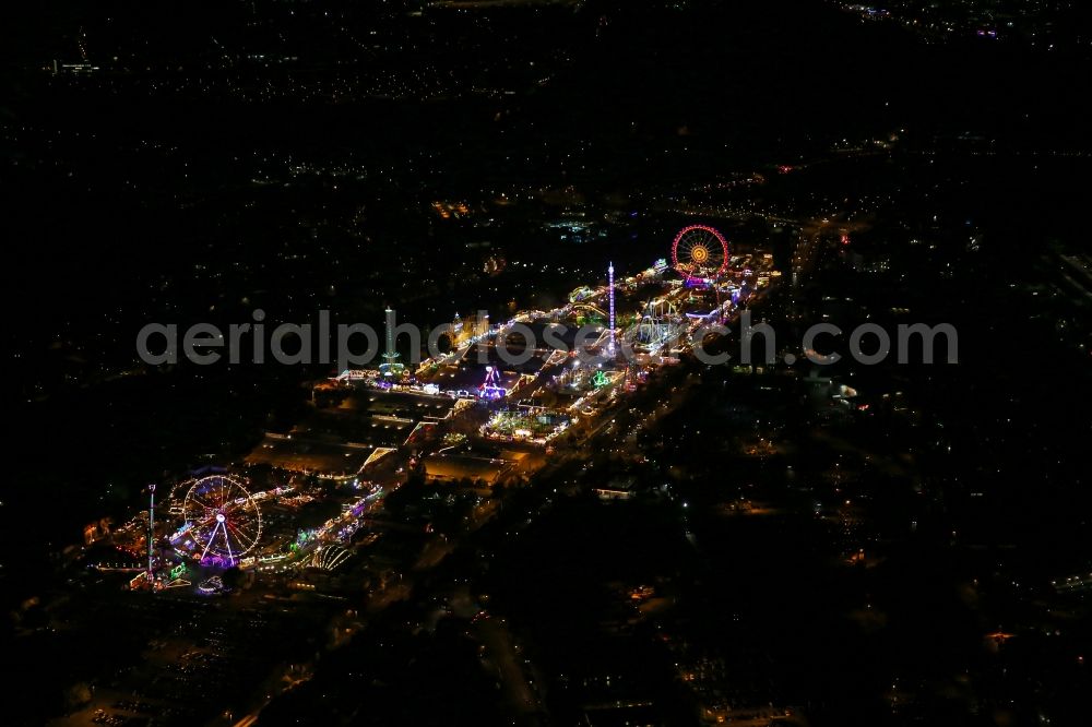 Stuttgart at night from the bird perspective: Night view of Fair - event location at festival auf den Cannstatter Wasen in Stuttgart in the state Baden-Wuerttemberg