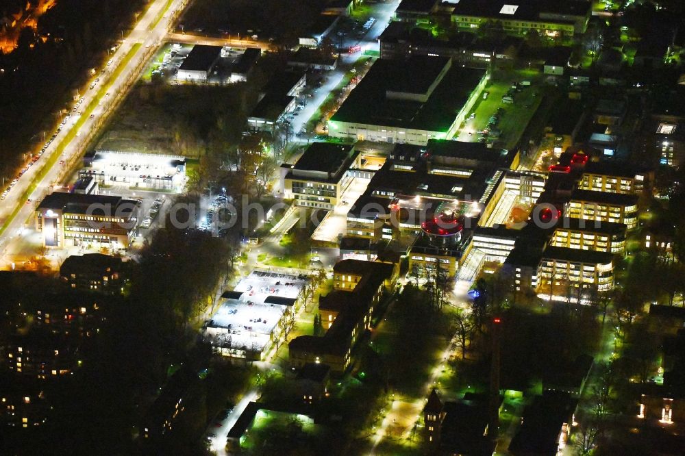 Berlin at night from the bird perspective: Night lighting Hospital grounds of the Clinic Unfallkrankenhaus Berlin on Warener Strasse in the district Marzahn in Berlin, Germany