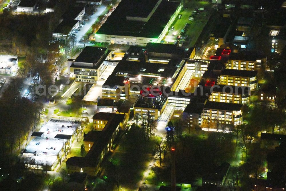 Aerial photograph at night Berlin - Night lighting Hospital grounds of the Clinic Unfallkrankenhaus Berlin on Warener Strasse in the district Marzahn in Berlin, Germany