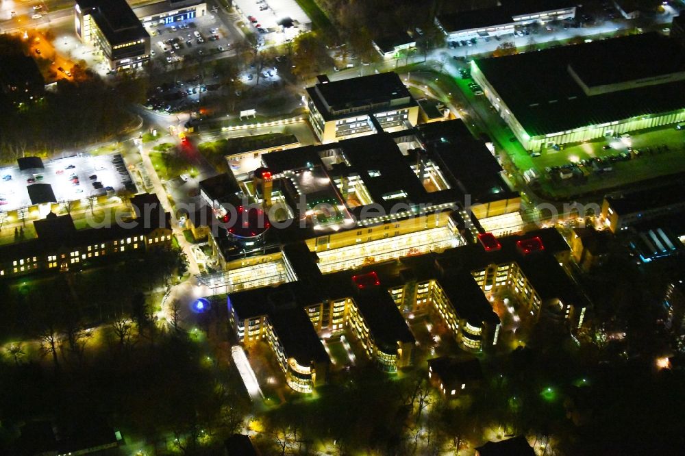 Berlin at night from the bird perspective: Night lighting Hospital grounds of the Clinic Unfallkrankenhaus Berlin on Warener Strasse in the district Marzahn in Berlin, Germany