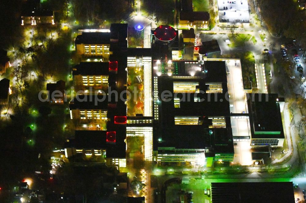 Berlin at night from the bird perspective: Night lighting Hospital grounds of the Clinic Unfallkrankenhaus Berlin on Warener Strasse in the district Marzahn in Berlin, Germany