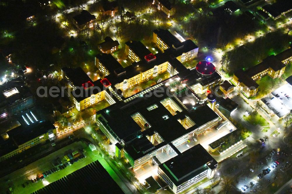 Aerial image at night Berlin - Night lighting Hospital grounds of the Clinic Unfallkrankenhaus Berlin on Warener Strasse in the district Marzahn in Berlin, Germany