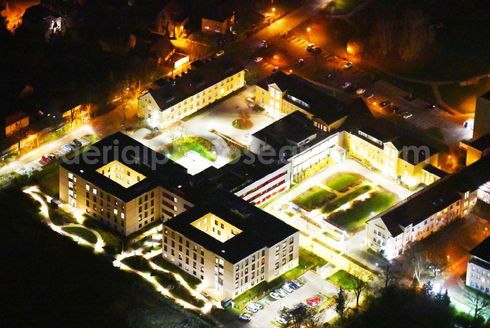 Aerial image at night Berlin - Night lighting Hospital grounds of the Clinic Vivantes Klinikum Kaulsdorf in the district Kaulsdorf in Berlin, Germany