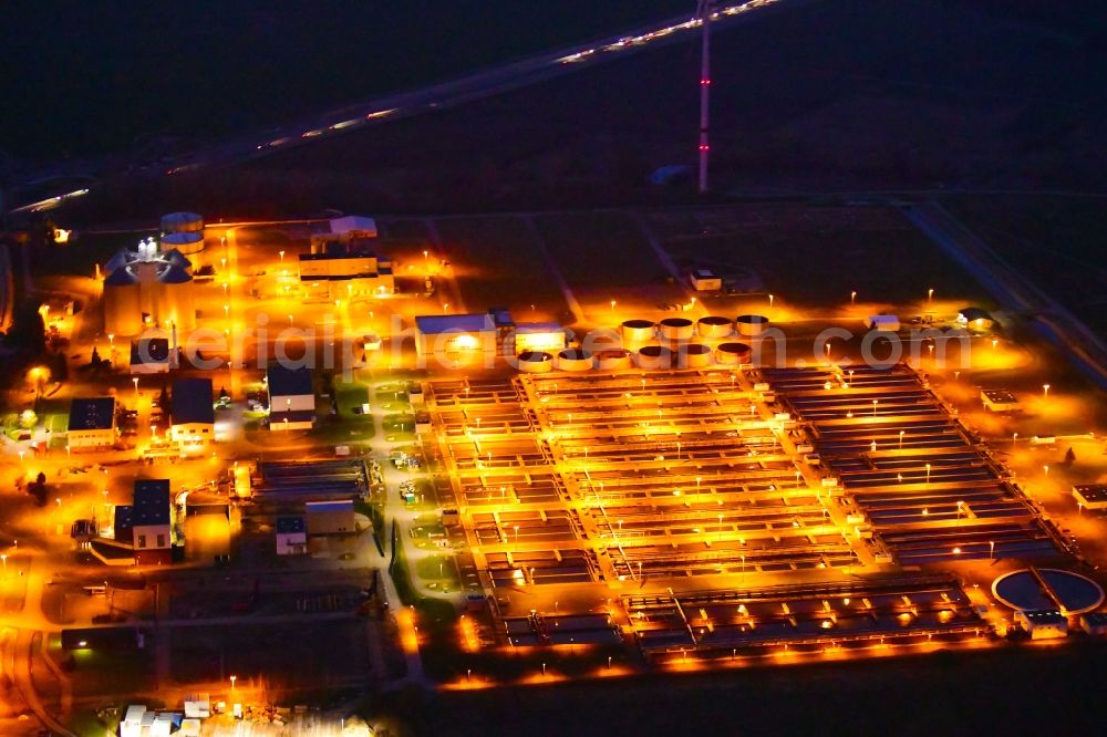 Wandlitz at night from above - Night lighting sewage works Basin and purification steps for waste water treatment in Schoenerlinde in the state Brandenburg, Germany