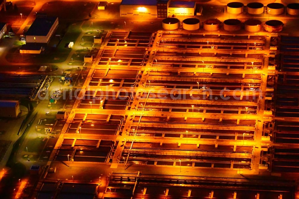 Aerial photograph at night Wandlitz - Night lighting sewage works Basin and purification steps for waste water treatment in Schoenerlinde in the state Brandenburg, Germany